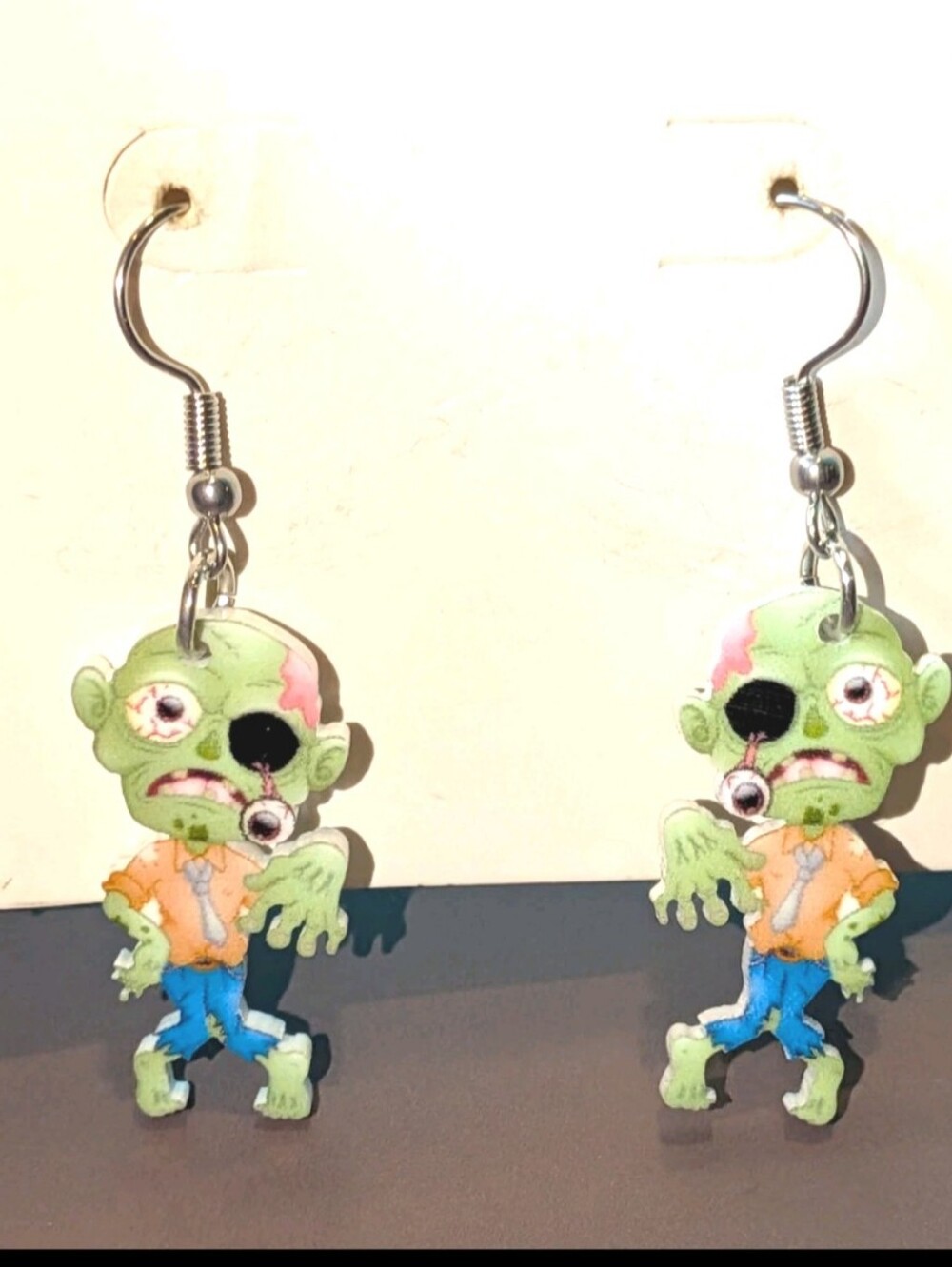 Hand Crafted Green Zombie Dangle Earrings with Orange and Blue Accents